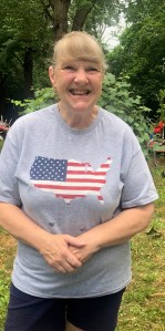Mary Lou Henriquez wearing an Ameican flag t-shirt
